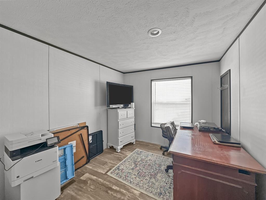 303 Mesa Ridge Decatur, TX 76234 - Photo 15 of 21 a living room with furniture and a flat screen tv