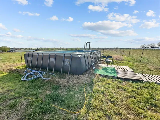 a view of a lake with a yard