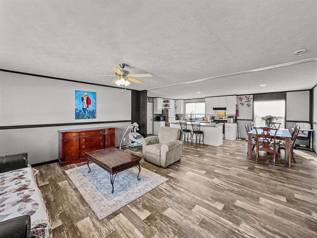 303 Mesa Ridge Decatur, TX 76234 - Photo 4 of 21 a living room with furniture and a view of dining room