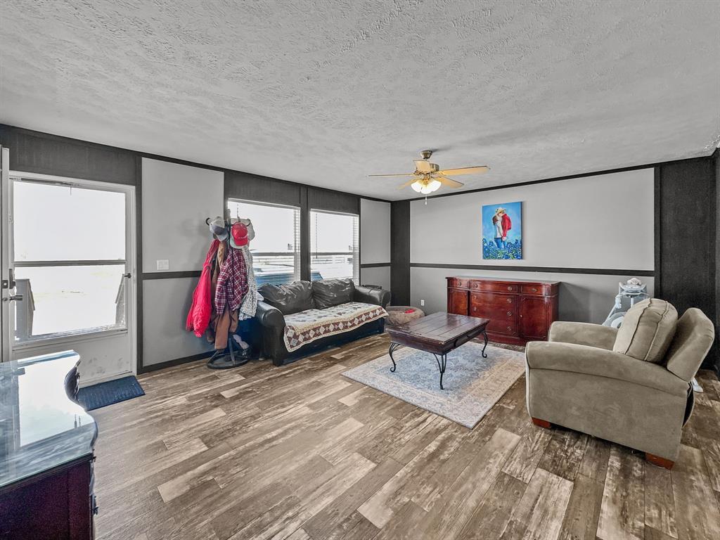 303 Mesa Ridge Decatur, TX 76234 - Photo 5 of 21 a living room with furniture and a wooden floor