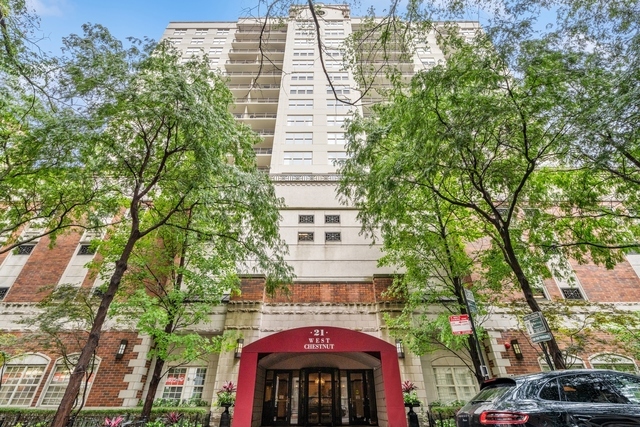 21 West Chestnut Street, Unit 1509 Chicago, IL 60610 - Photo 1 of 34 front view of a building with a tree