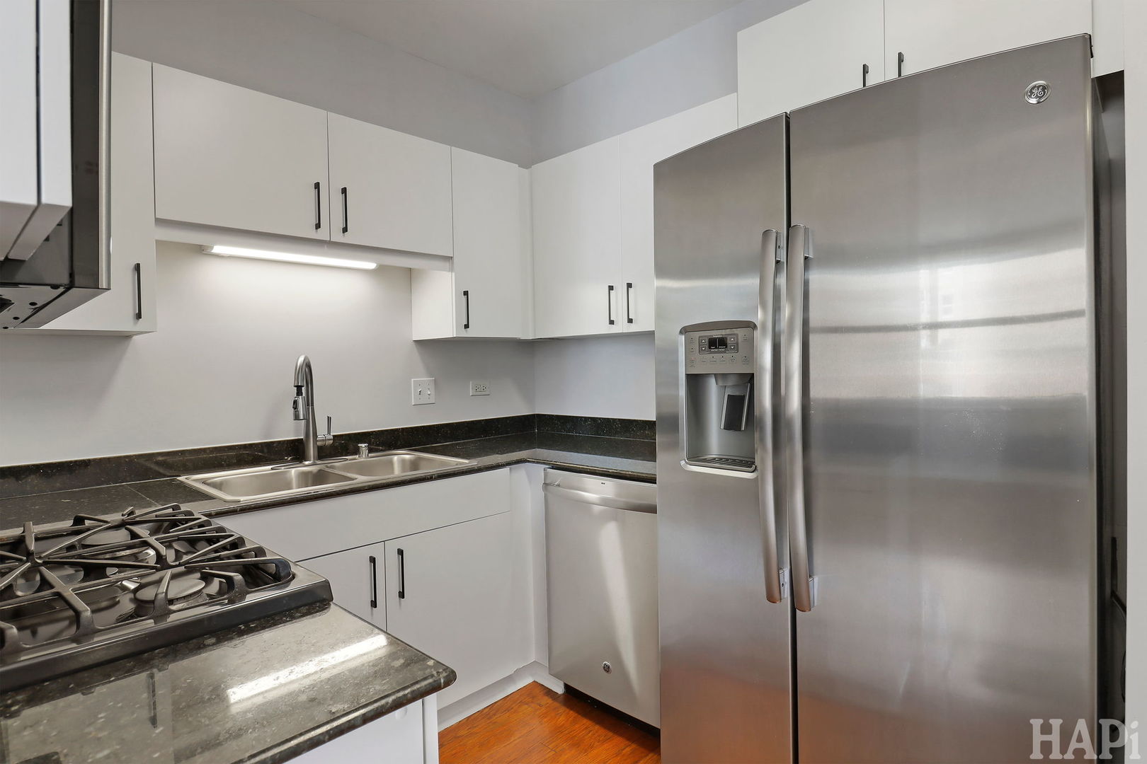 21 West Chestnut Street, Unit 1509 Chicago, IL 60610 - Photo 14 of 34 a kitchen with stainless steel appliances granite countertop a refrigerator and a stove
