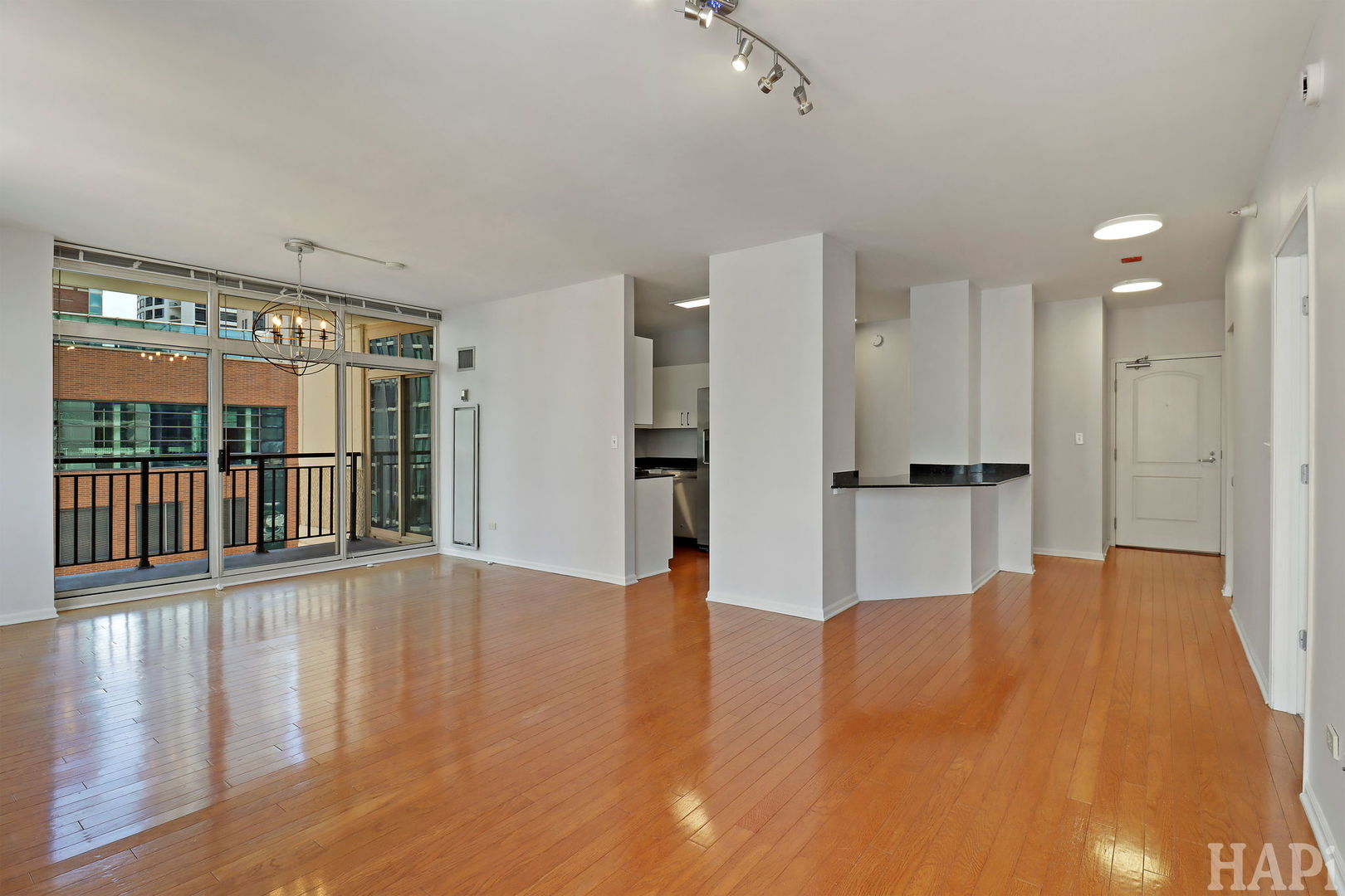 21 West Chestnut Street, Unit 1509 Chicago, IL 60610 - Photo 18 of 34 a view of empty room with wooden floor and a window