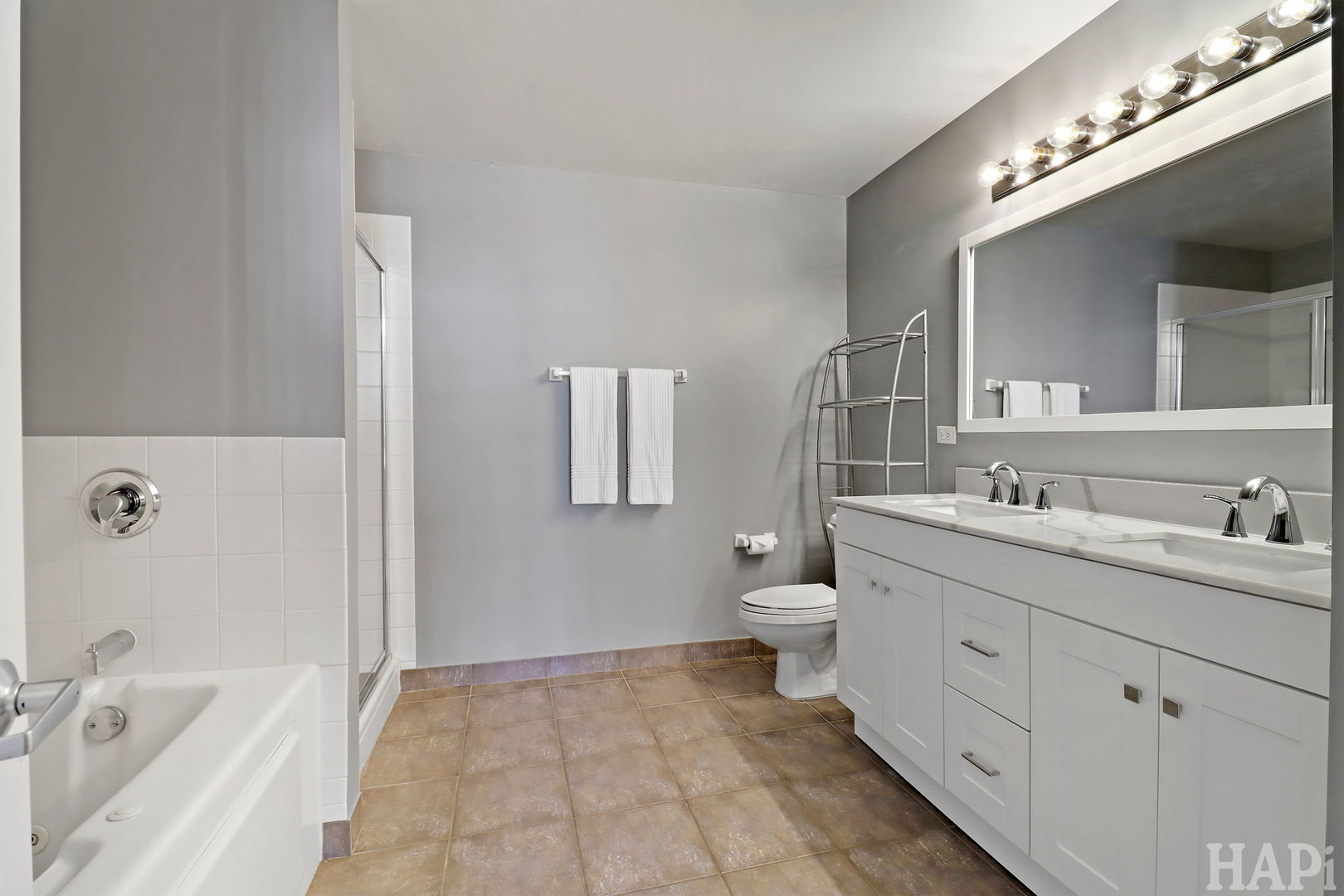 21 West Chestnut Street, Unit 1509 Chicago, IL 60610 - Photo 26 of 34 a bathroom with a sink double vanity and a mirror