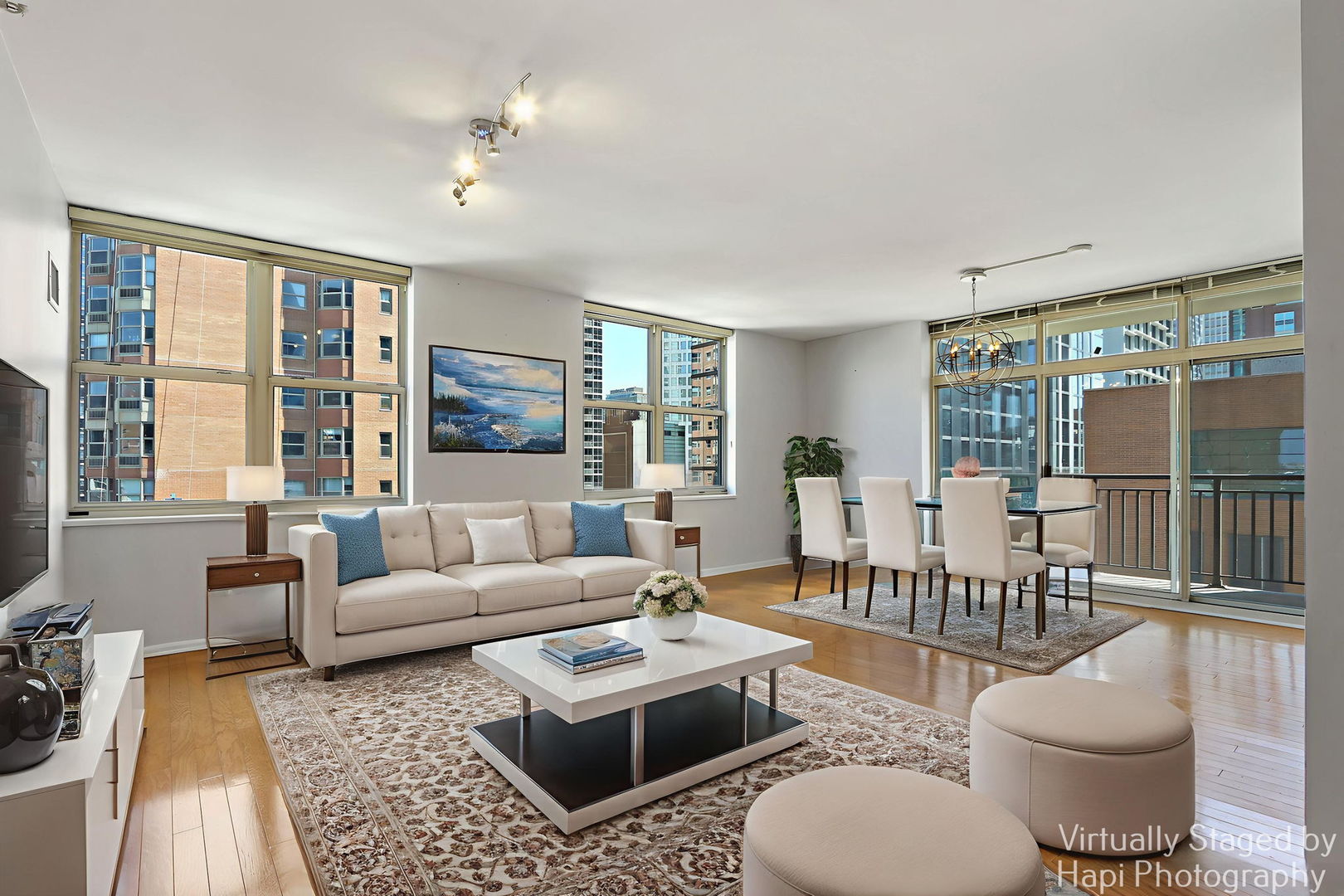 21 West Chestnut Street, Unit 1509 Chicago, IL 60610 - Photo 7 of 34 a living room with furniture a table and a large window