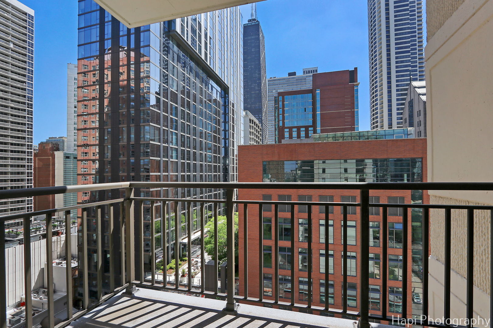 21 West Chestnut Street, Unit 1509 Chicago, IL 60610 - Photo 10 of 34 a view of a balcony with wooden floor