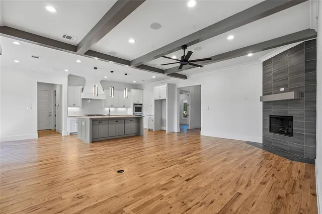 a kitchen with stainless steel appliances granite countertop a stove and a refrigerator
