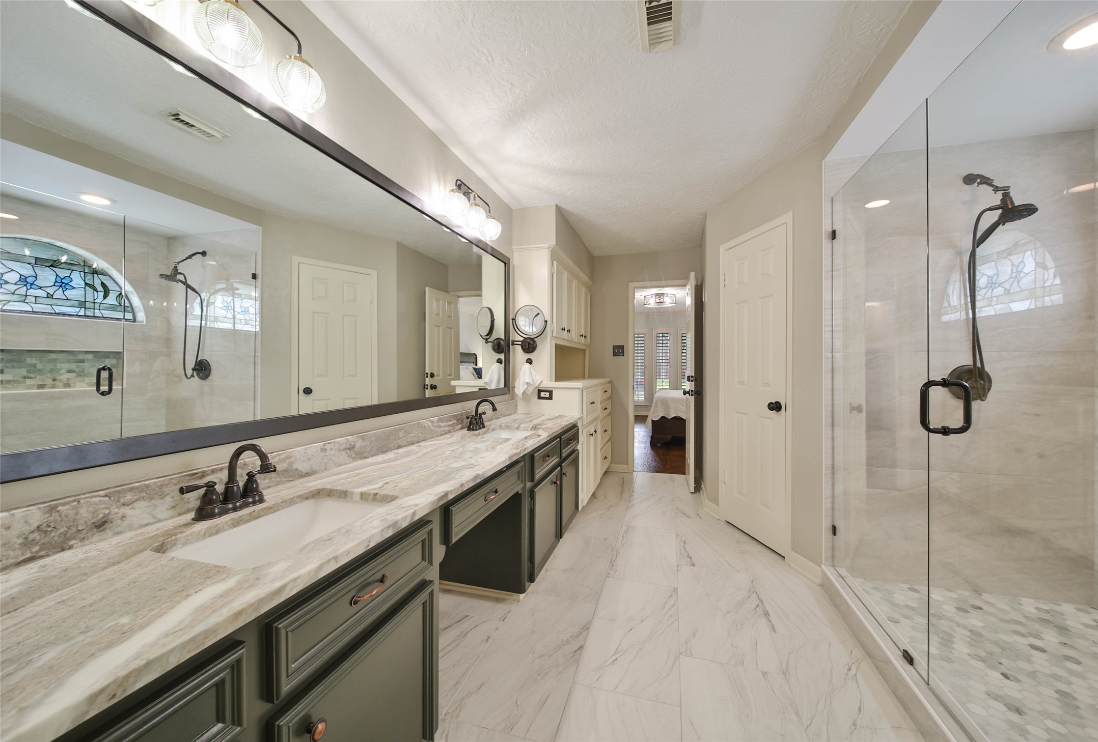 17007 Windrow Drive Spring, TX 77379 - Photo 23 of 46 a spacious bathroom with a granite countertop sink mirror and double