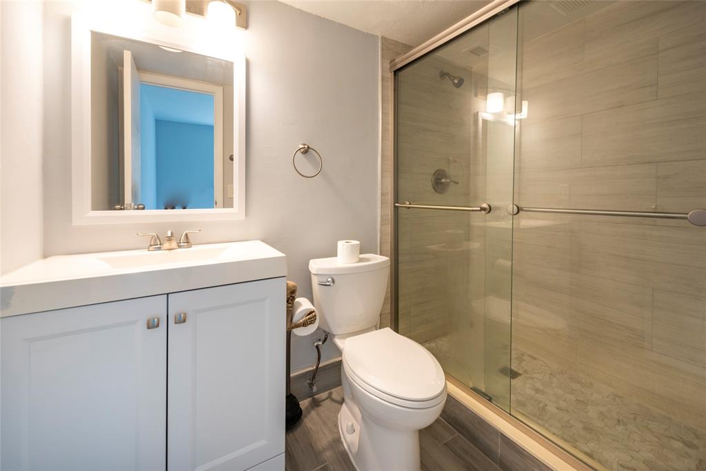 6061 North Falls Cir Drive, Unit 102 Lauderhill, FL 33319 - Photo 15 of 26 a bathroom with a sink toilet and shower