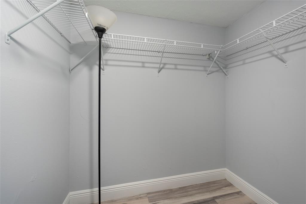 6061 North Falls Cir Drive, Unit 102 Lauderhill, FL 33319 - Photo 19 of 26 a view of a room with racks on the wall