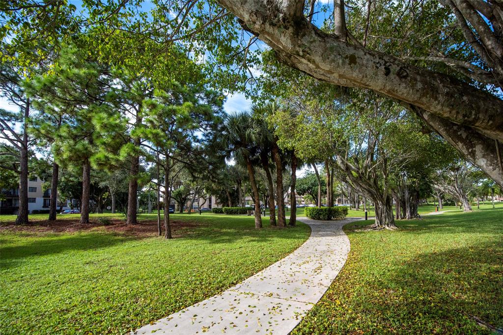 6061 North Falls Cir Drive, Unit 102 Lauderhill, FL 33319 - Photo 22 of 26 a view of a park with tree s