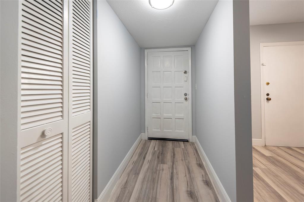 6061 North Falls Cir Drive, Unit 102 Lauderhill, FL 33319 - Photo 25 of 26 a view of a room with wooden floor