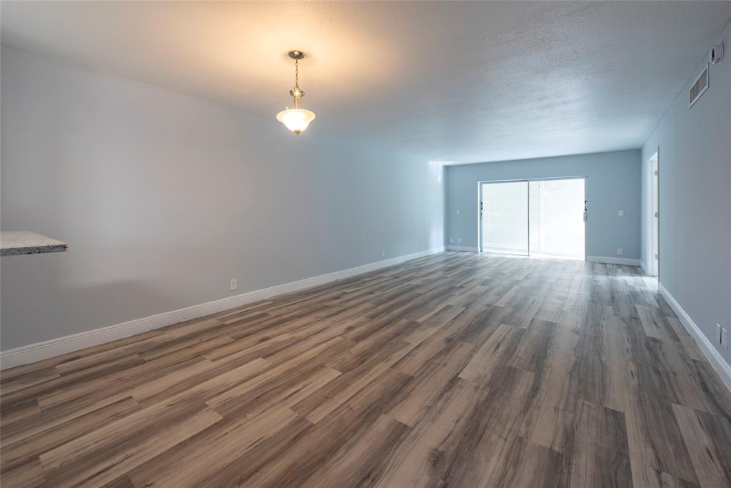 6061 North Falls Cir Drive, Unit 102 Lauderhill, FL 33319 - Photo 6 of 26 a view of empty room with wooden floor