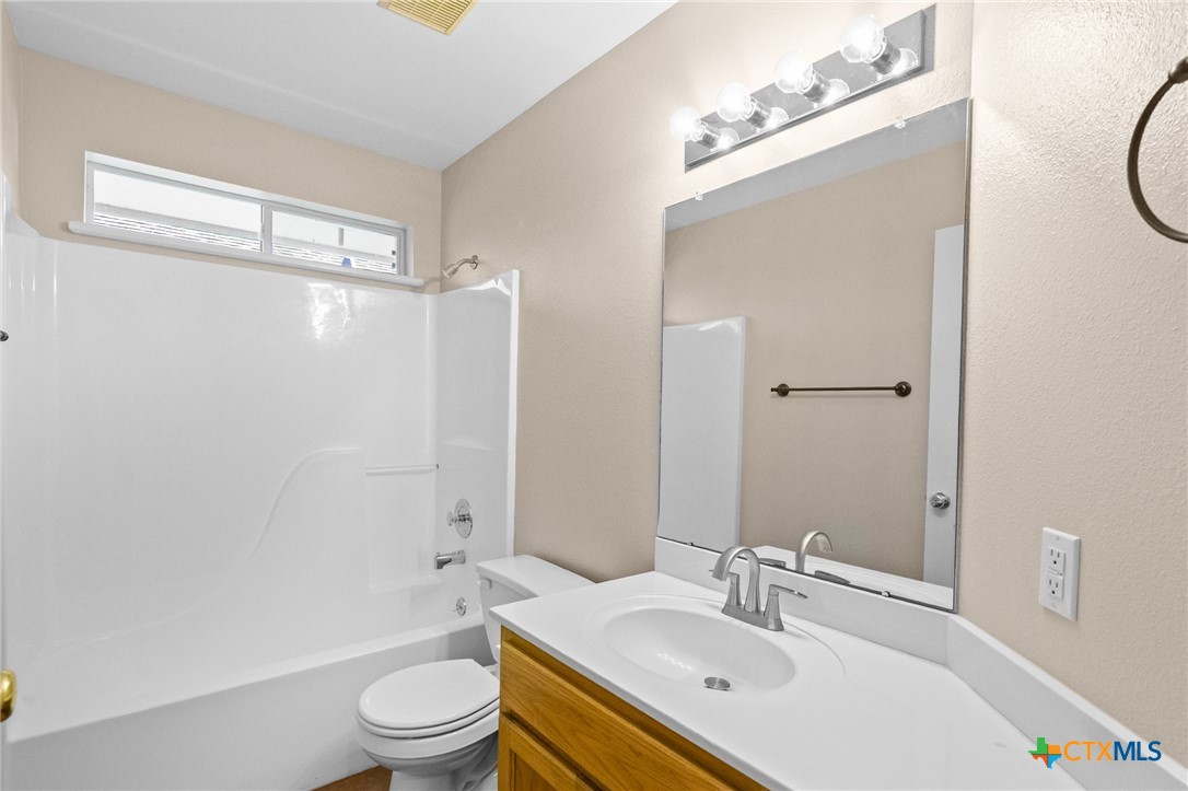 409 Newhaven Street Victoria, TX 77904 - Photo 19 of 28 a bathroom with a sink a toilet and shower