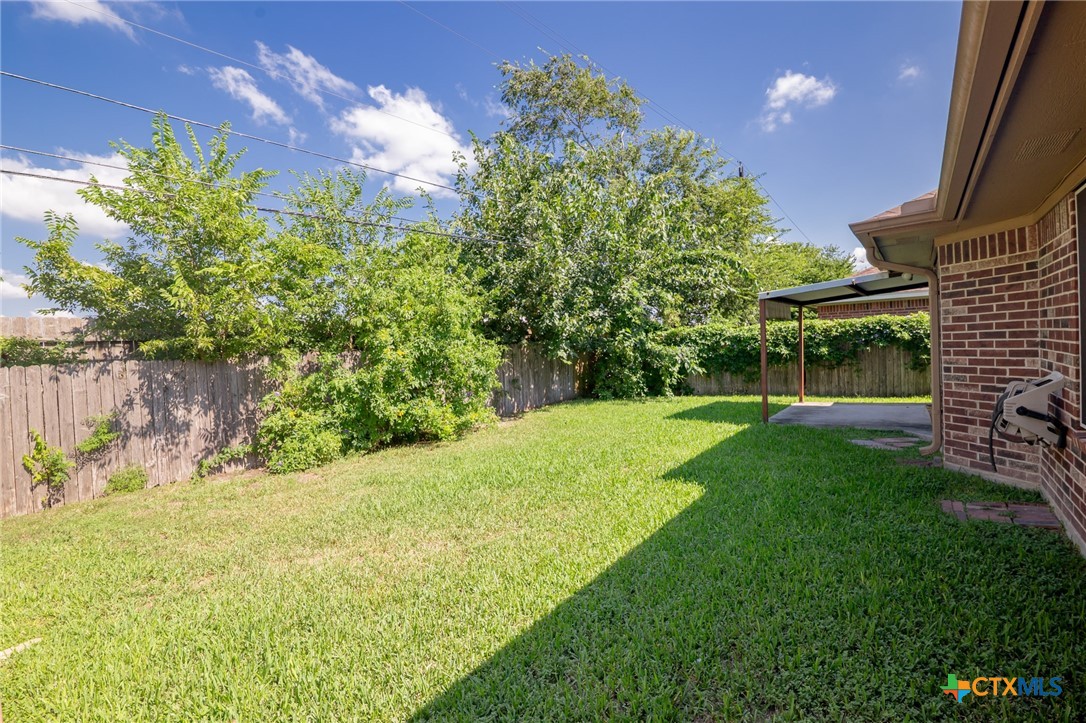 409 Newhaven Street Victoria, TX 77904 - Photo 24 of 28 a view of a yard with a house