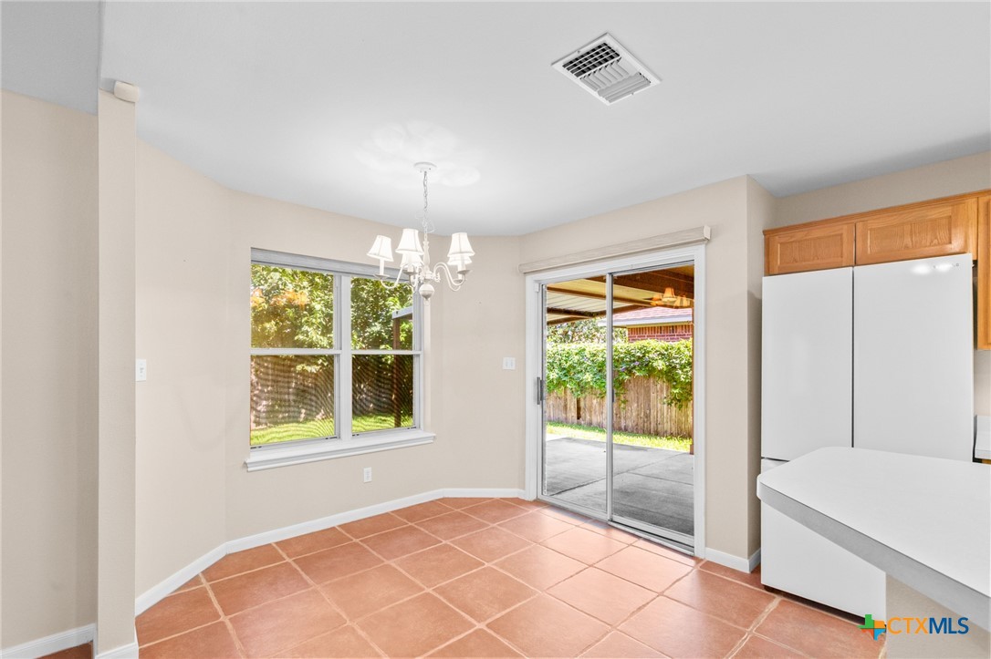 409 Newhaven Street Victoria, TX 77904 - Photo 10 of 28 a bedroom with a bed and a large window with outer view