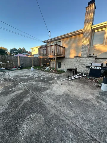 a view of a car park in front of a house
