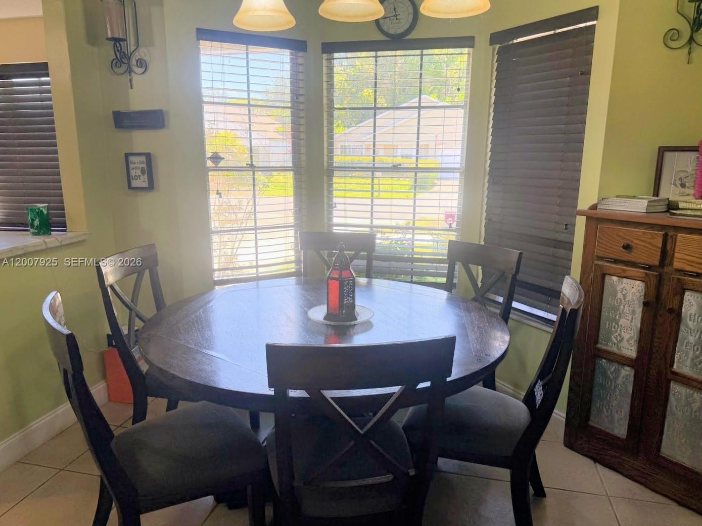 13541 Southwest 10th Place Davie, FL 33325 - Photo 6 of 20 a view of a dining room with furniture window and outside view