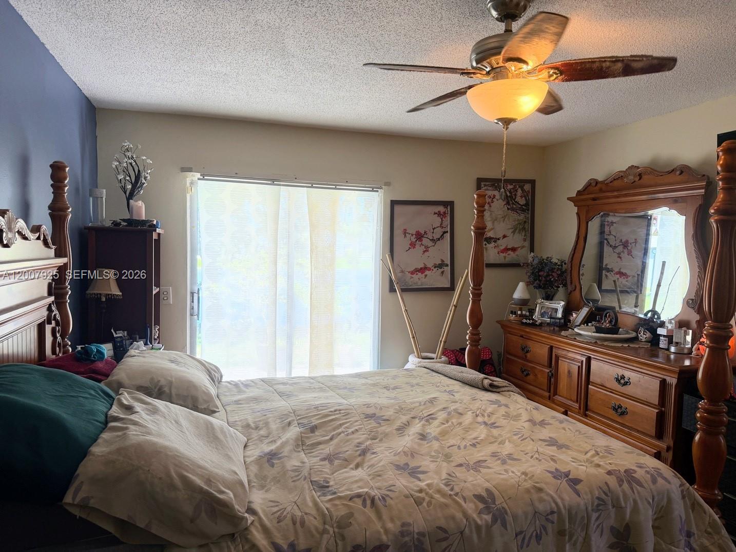 13541 Southwest 10th Place Davie, FL 33325 - Photo 7 of 20 a bedroom with a bed and dresser