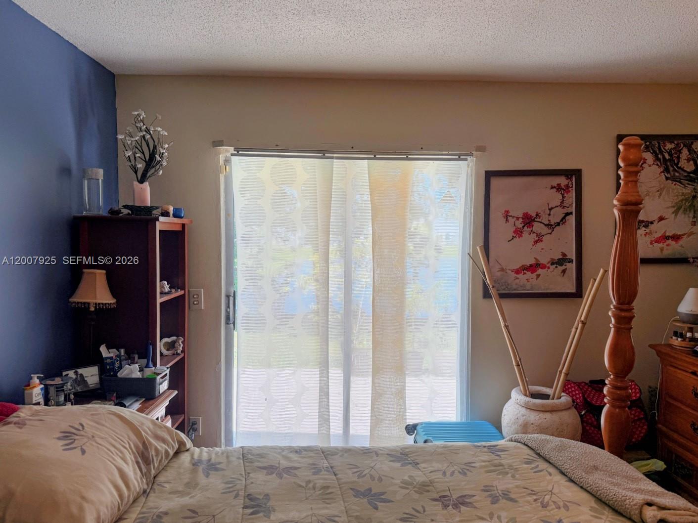 13541 Southwest 10th Place Davie, FL 33325 - Photo 8 of 20 a bedroom with a bed and a couch