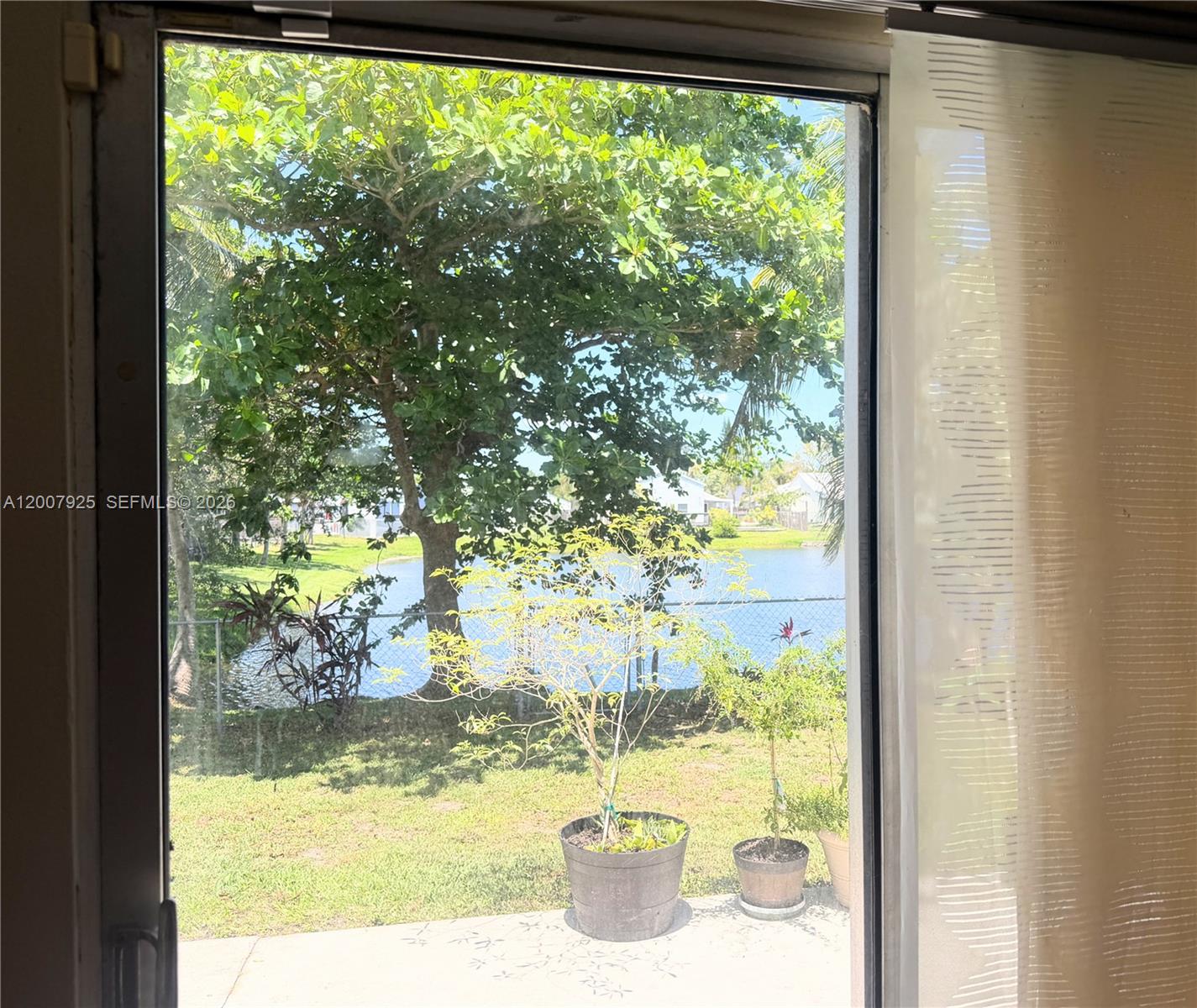 13541 Southwest 10th Place Davie, FL 33325 - Photo 9 of 20 a view of a glass door and porch