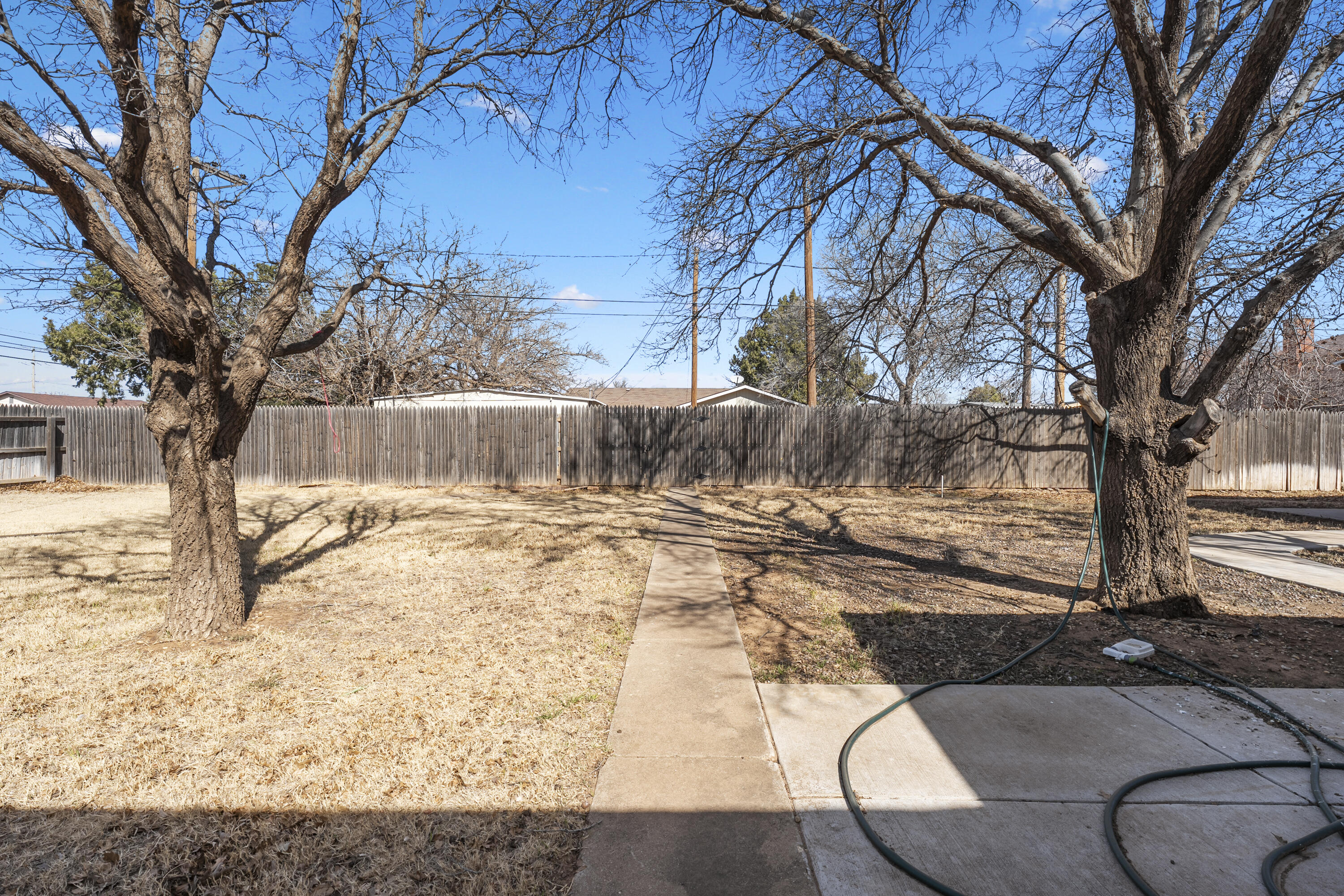 1201 8th Street Shallowater, TX 79363 - Photo 17 of 20 a view of yard covered with snow in front of house