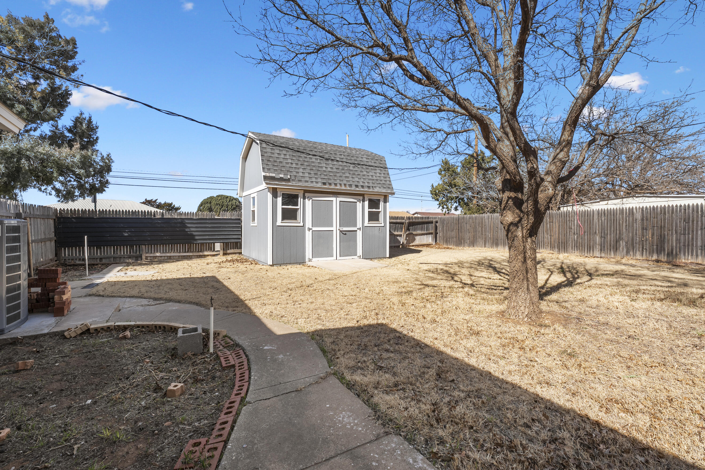 1201 8th Street Shallowater, TX 79363 - Photo 18 of 20 a house with trees in front of it