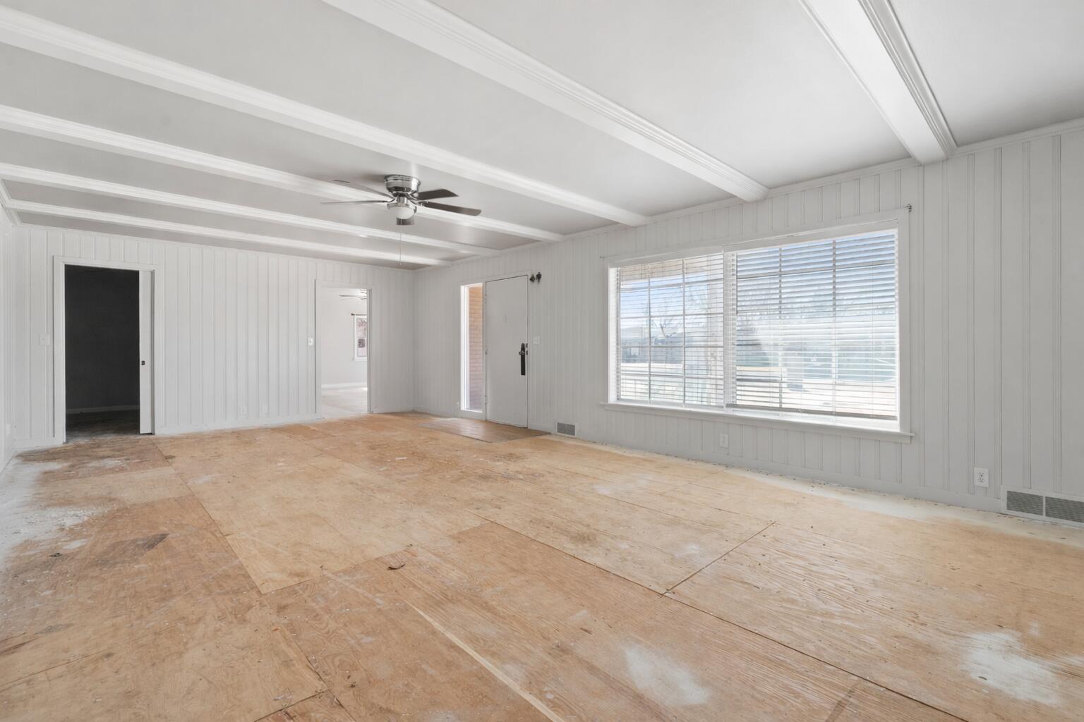 1201 8th Street Shallowater, TX 79363 - Photo 3 of 20 a view of an empty room with a window