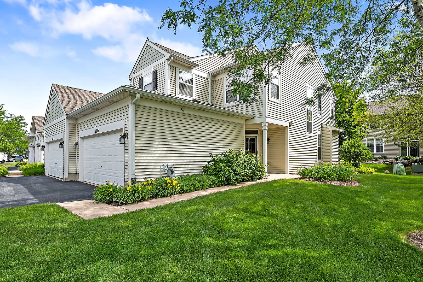 2926 Rutland Circle Naperville, IL 60564 - Photo 1 of 9 a front view of a house with a garden