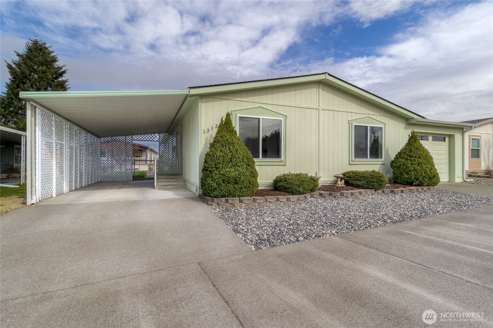 a view of a house with a garden