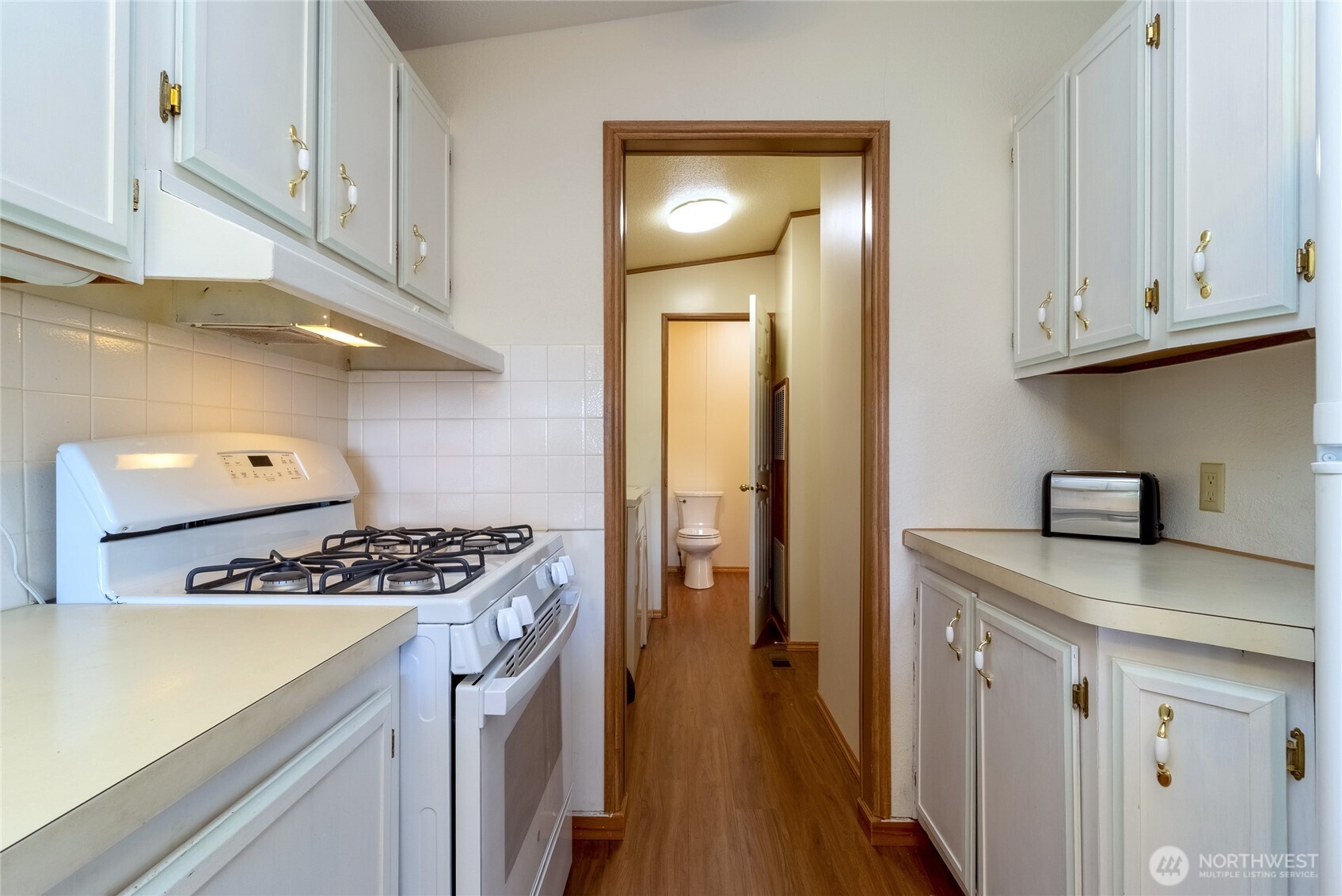 1312 Rancho Villa Walla Walla, WA 99362 - Photo 7 of 22 a kitchen with stainless steel appliances granite countertop a sink a stove and a refrigerator