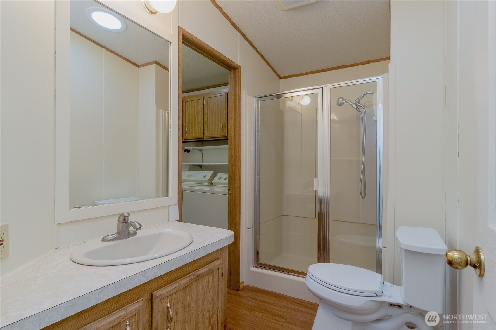 1312 Rancho Villa Walla Walla, WA 99362 - Photo 9 of 22 a bathroom with a granite countertop sink toilet and shower