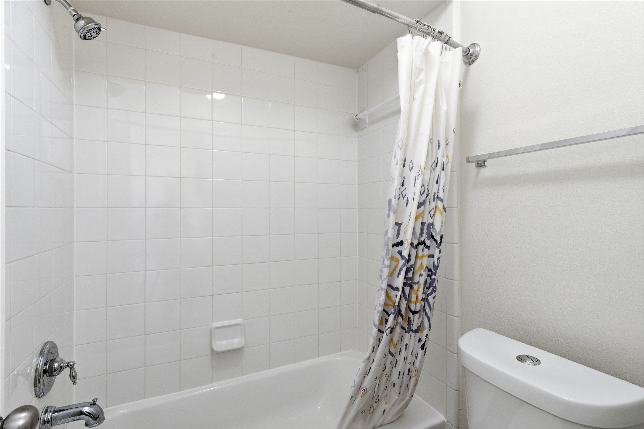 6211 Stone Hill Road Spring, TX 77389 - Photo 36 of 43 a bathroom with a bathtub a toilet and a shower