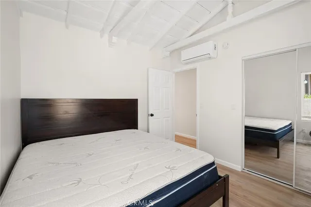 a bedroom with a bed and a table