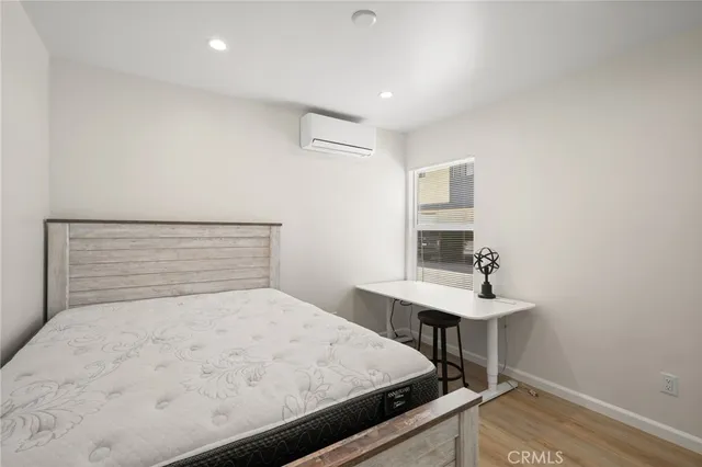 a bedroom with a bed and a table in it