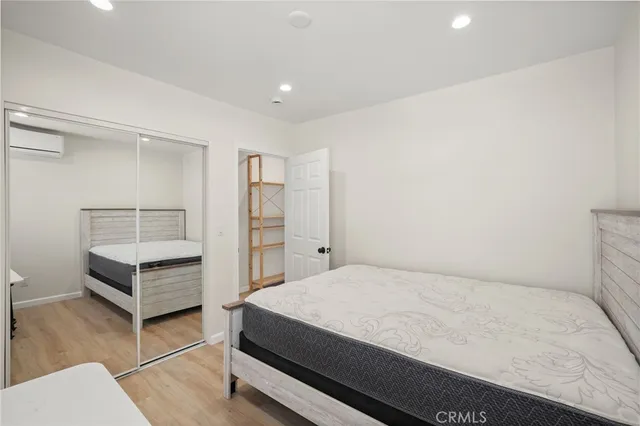 a room with a bed and cabinets