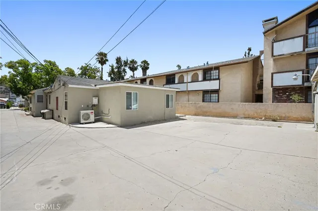 an aerial view of a building with outdoor space