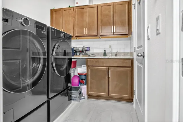 a utility room with dryer and washer