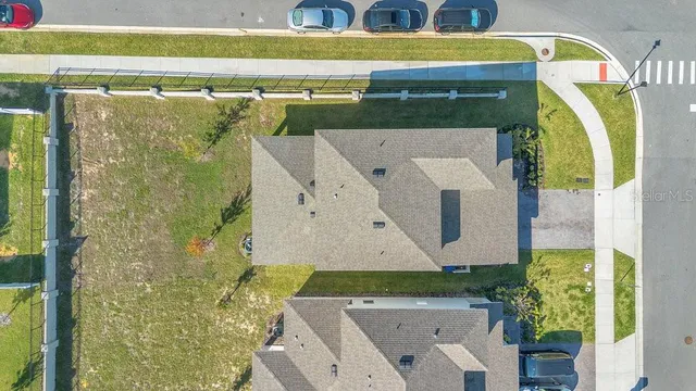 a aerial view of a house with a yard