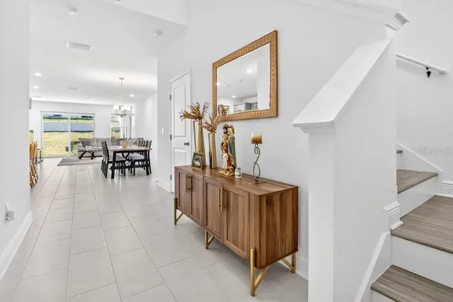 a view of a livingroom with furniture and staircase