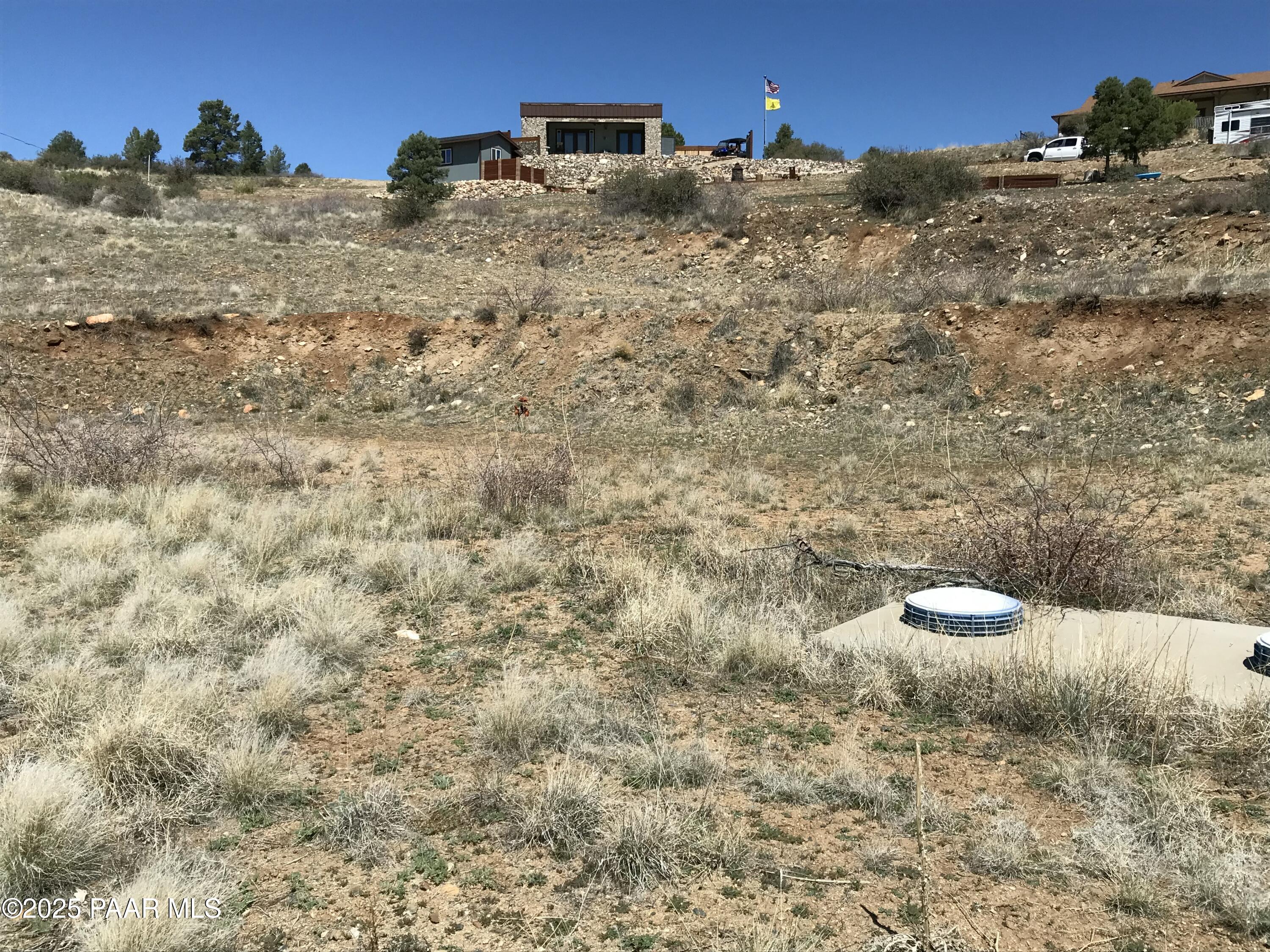 18351 Peeples Valley Road Peeples Valley, AZ 86332 - Photo 18 of 19 a view of a dry yard with wooden fence