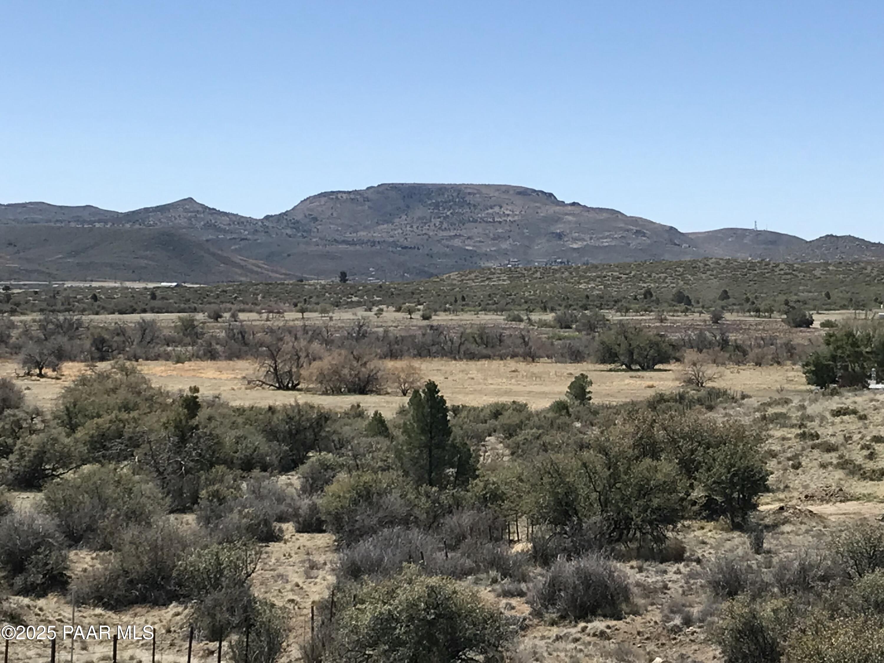 18351 Peeples Valley Road Peeples Valley, AZ 86332 - Photo 3 of 19 a view of a lake in middle of forest