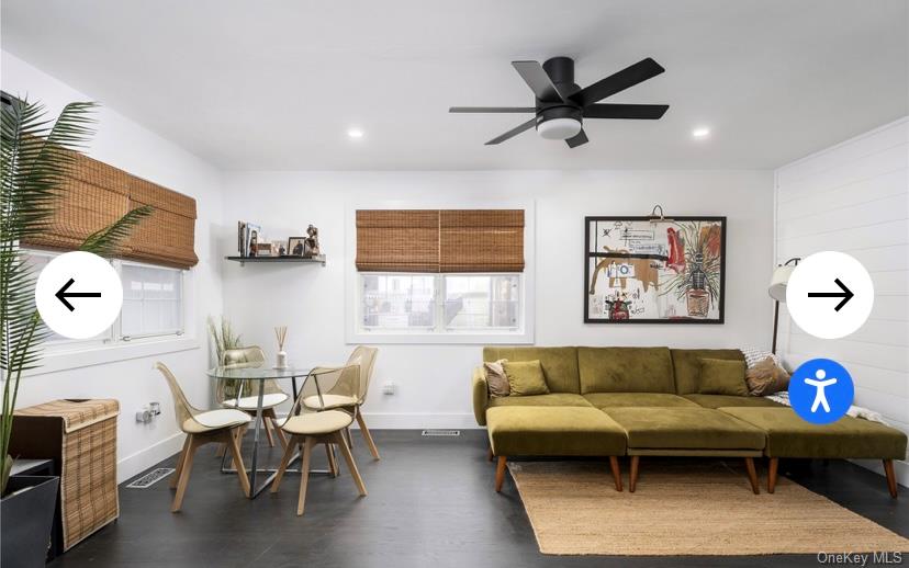 40 Canoe Place Road, Unit 3 Hampton Bays, NY 11946 - Photo 3 of 4 a living room with furniture and a window