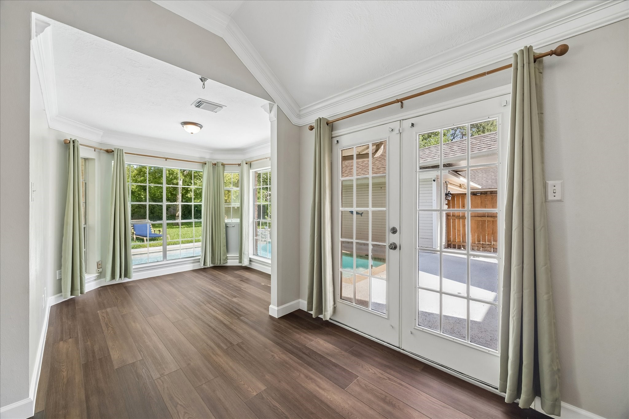 9110 Rhapsody Lane Houston, TX 77040 - Photo 18 of 28 There is a spacious sitting room in the primary bedroom overlooking the pool.