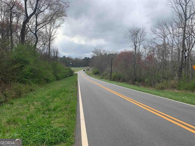 1156 County Line Road Griffin, GA 30224 - Photo 1 of 5 a view of a field with a trees in the background