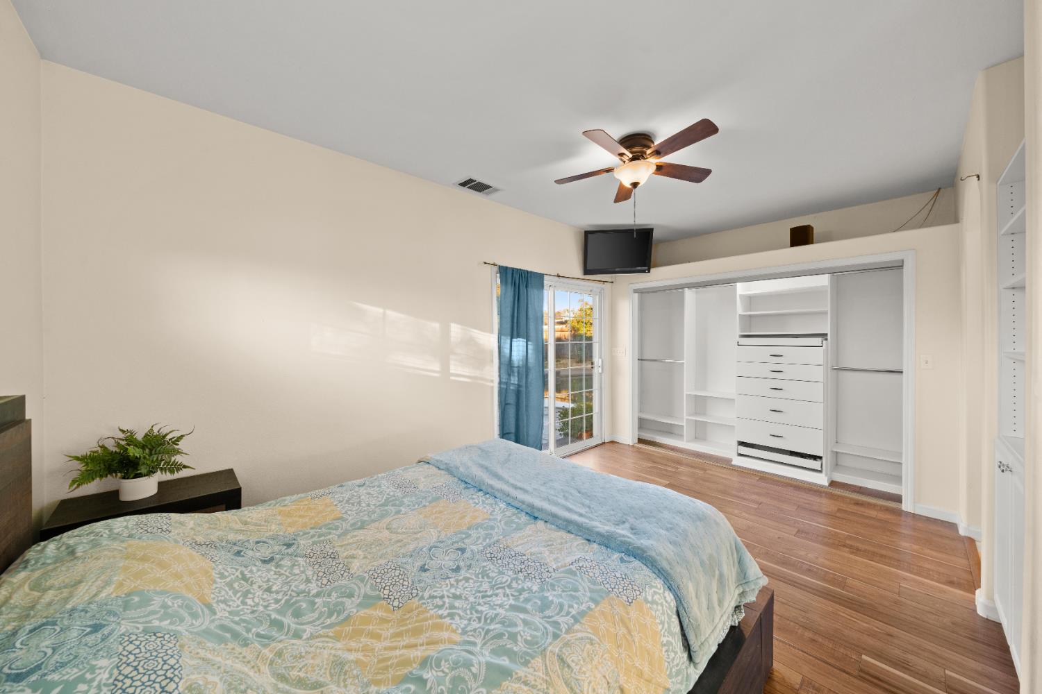 5001 Boyd Drive Carmichael, CA 95608 - Photo 13 of 49 a bedroom with a large bed and a chandelier