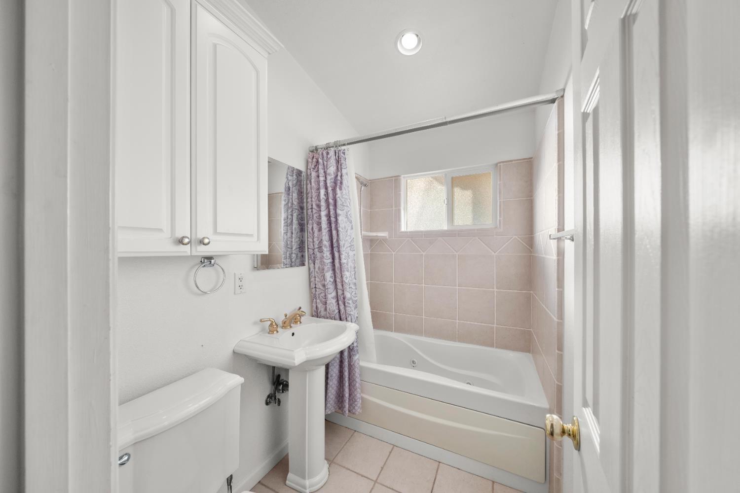 5001 Boyd Drive Carmichael, CA 95608 - Photo 19 of 49 a bathroom with a sink a toilet and shower