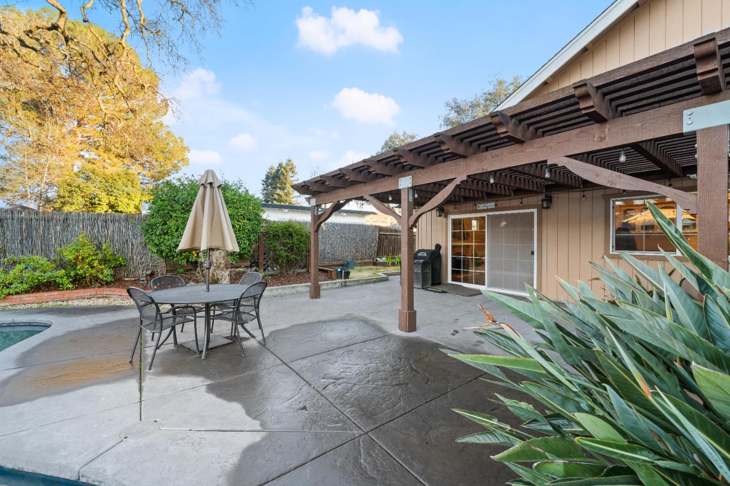 5001 Boyd Drive Carmichael, CA 95608 - Photo 26 of 49 a view of a patio with table and chairs and potted plants
