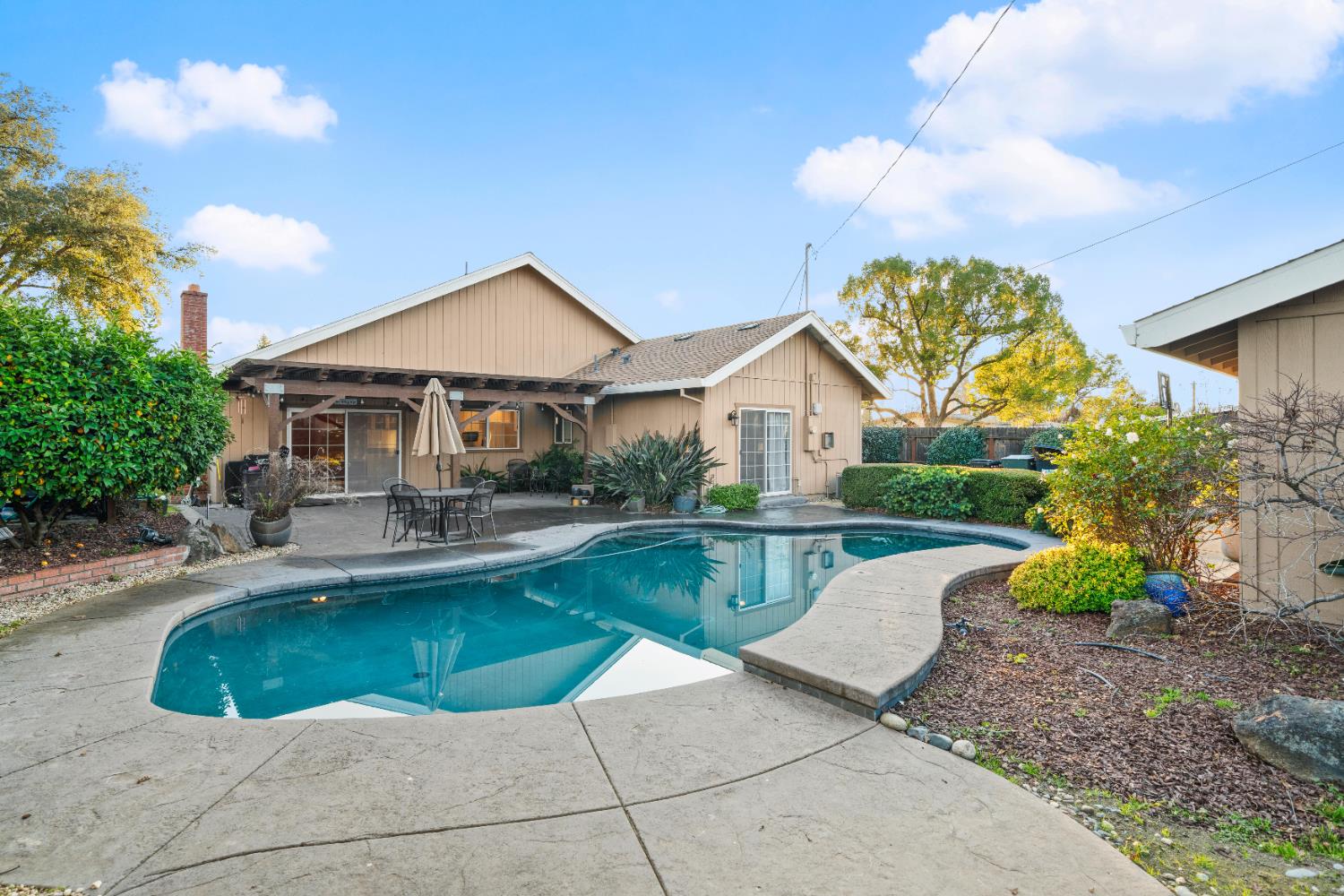 5001 Boyd Drive Carmichael, CA 95608 - Photo 28 of 49 a view of a house with swimming pool and sitting area