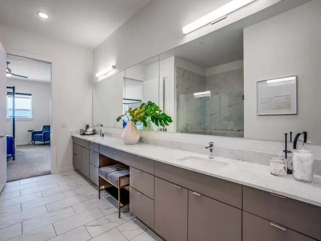 a bathroom with a sink double vanity and a mirror